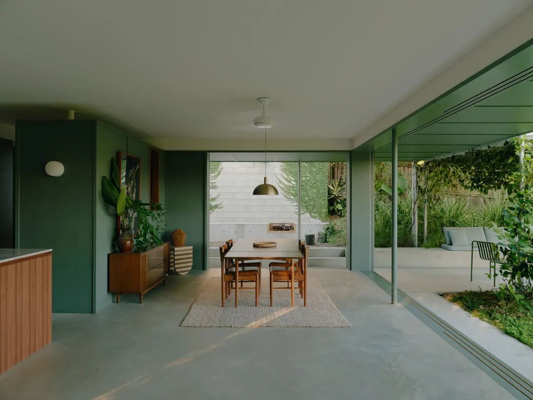 Long view through the mid-century dining room to the garden