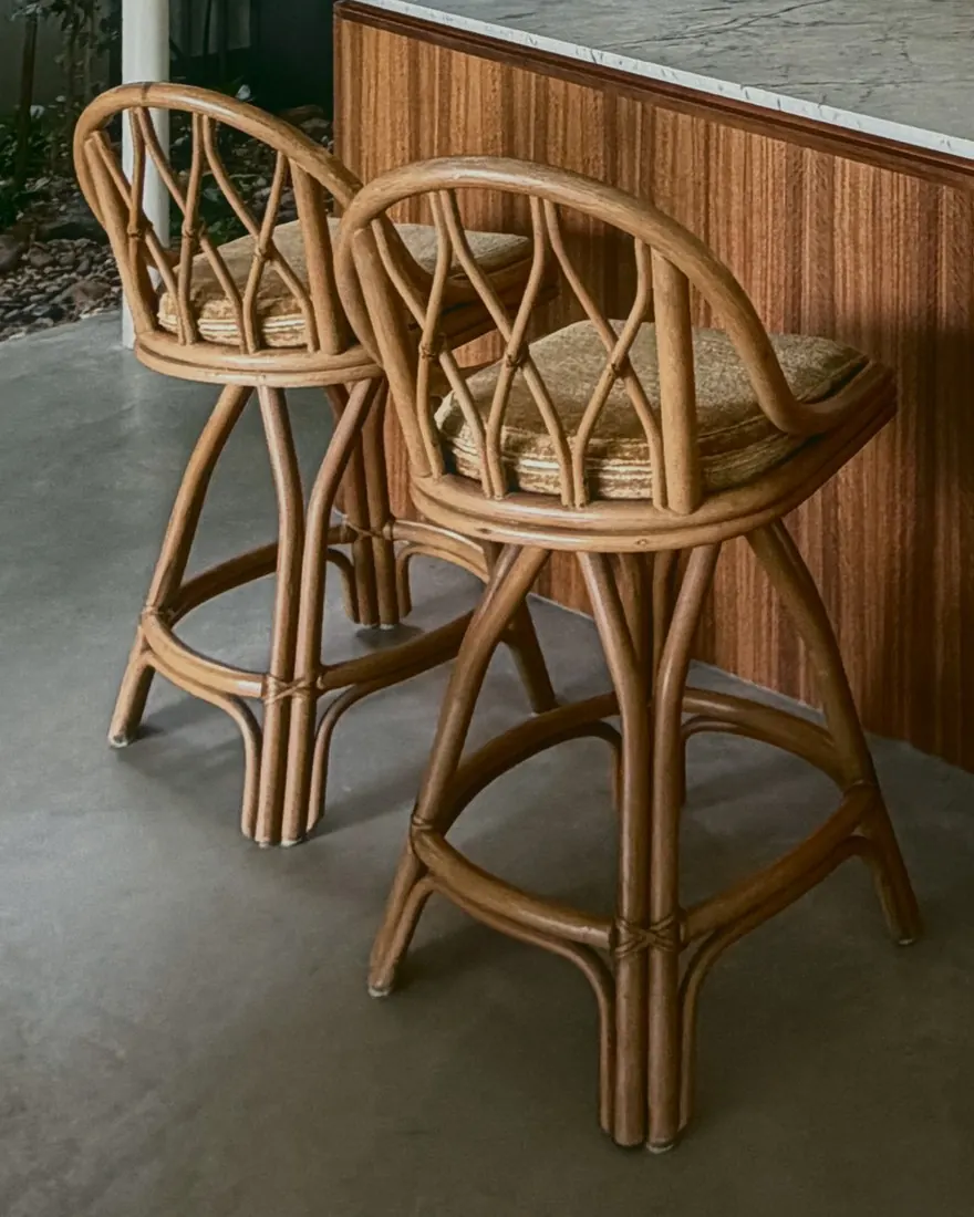 Two rattan counter stools at the spotted gum island